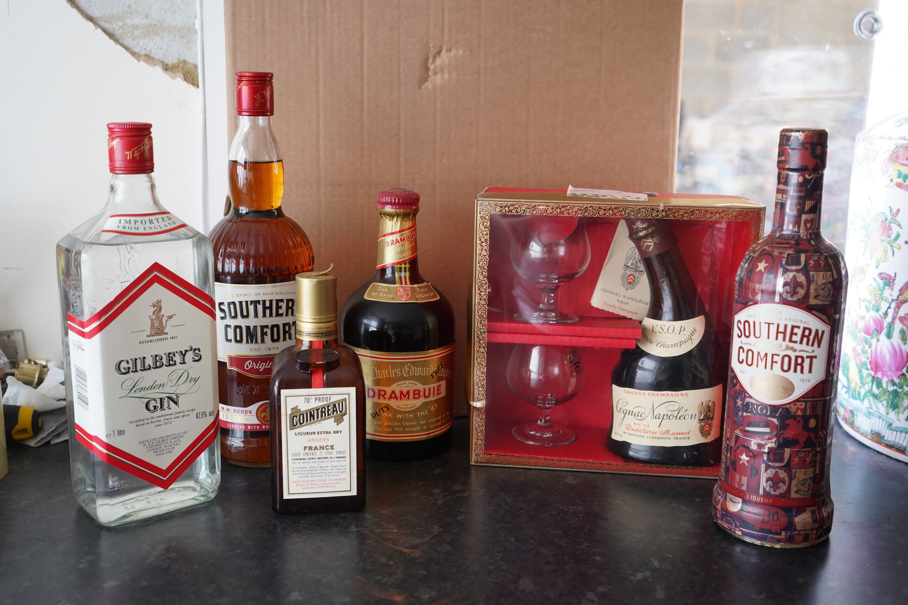 Six bottles of spirits and liqueurs, including whiskey and gin